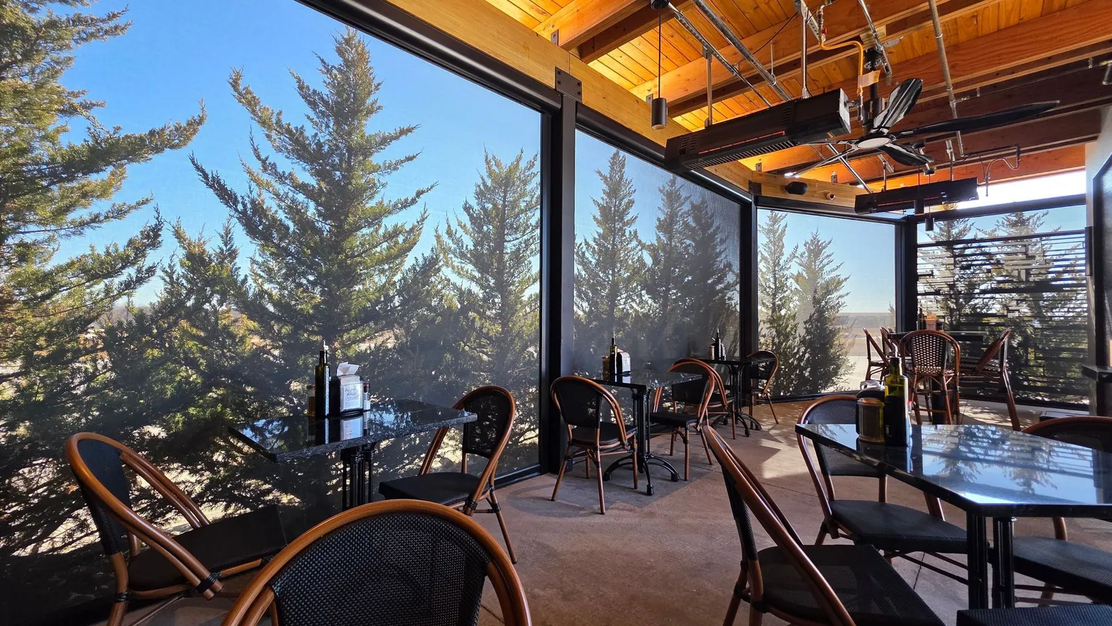 95% solar screens lowered around the Meddy's patio dining tables