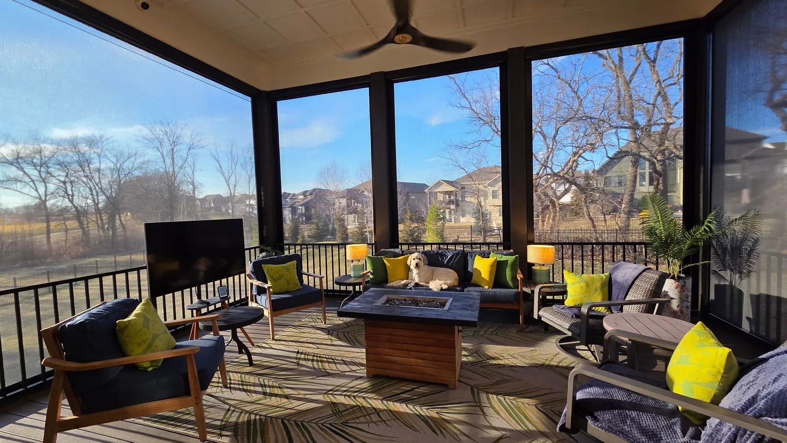 Tim's covered back deck with motorized exterior shades, furniture set out for winter