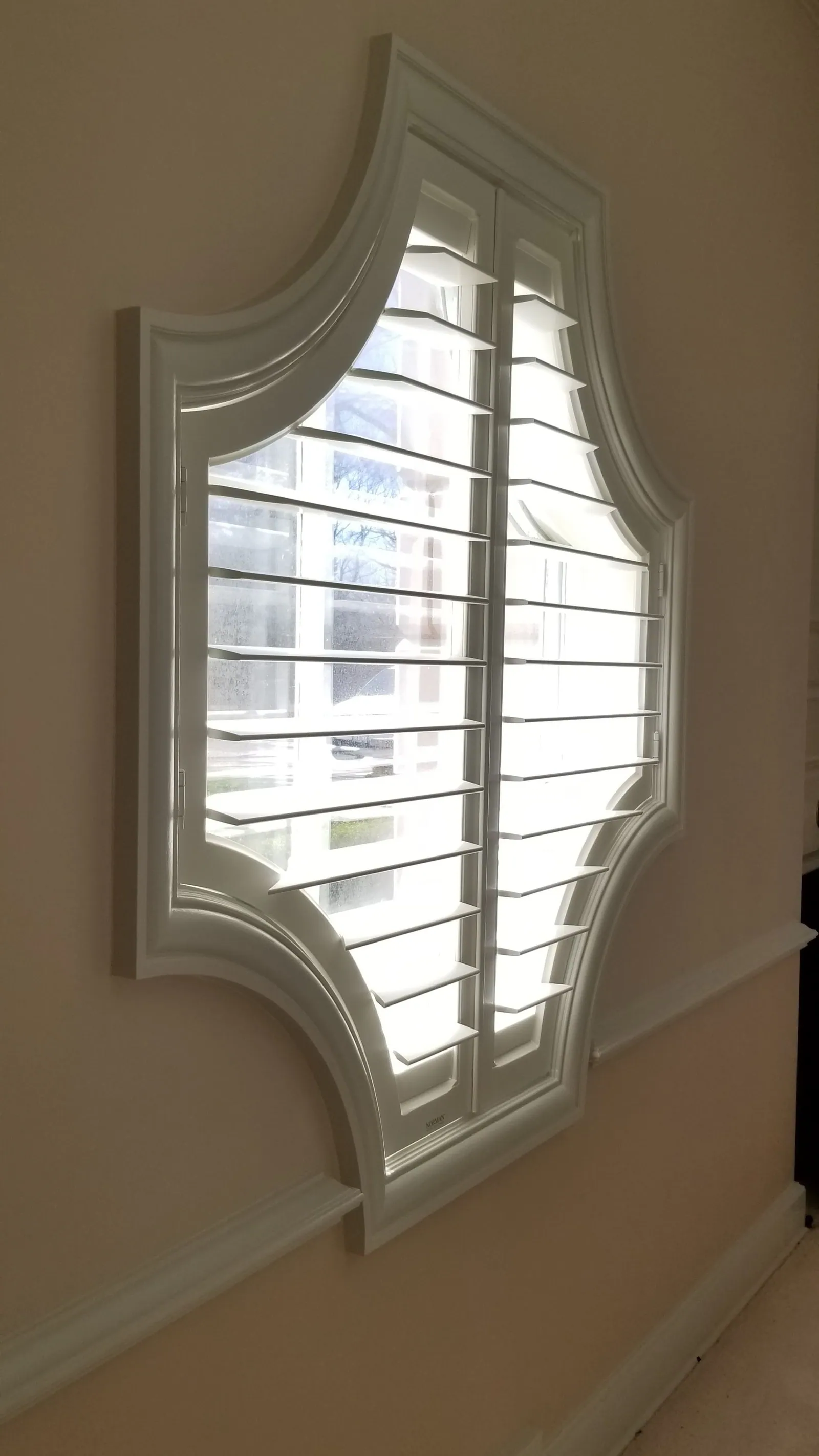 The shutters closed, seen across the room