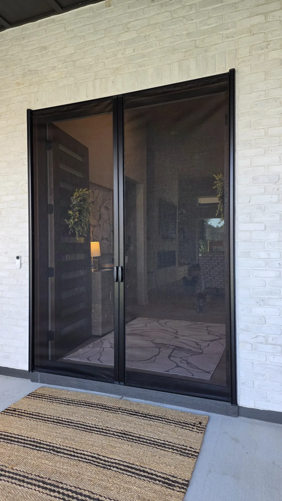 Sliding Screens drawn across open double front doors