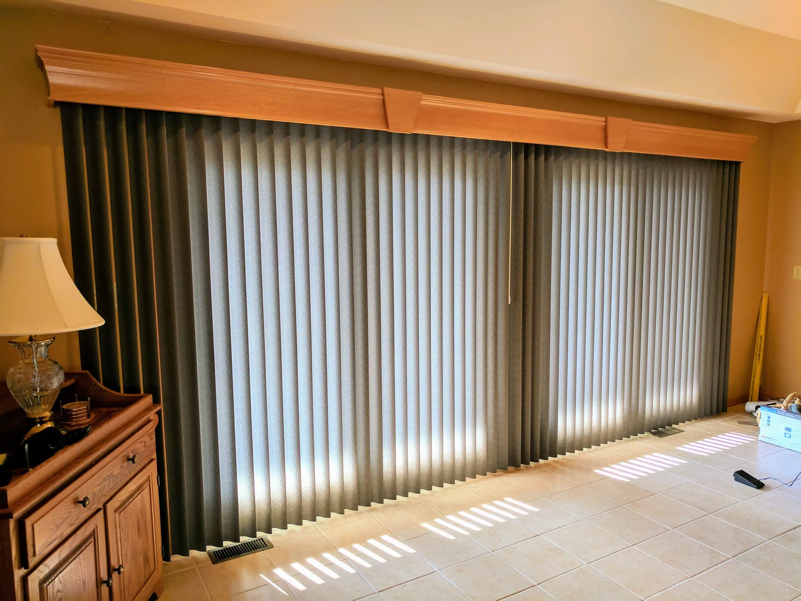 Black vertical blinds on a sliding glass door