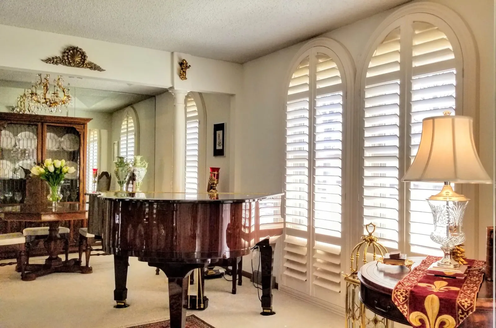 Arched shutters built to a template and fitted to a pair of curved openings