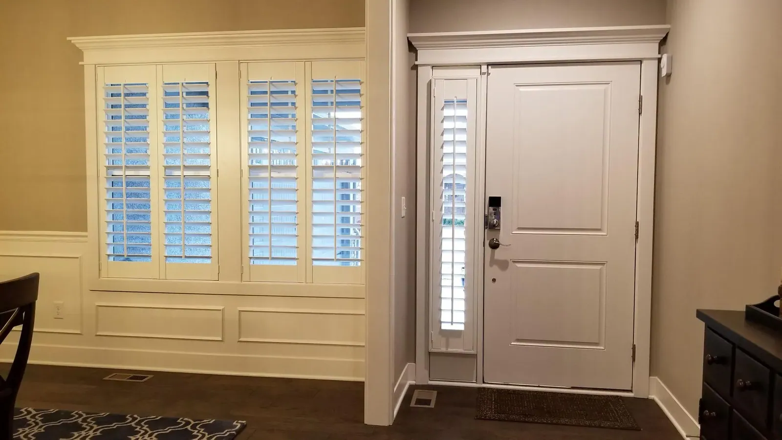 Plantation Shutters on the entry window and the single sidelight beside the door