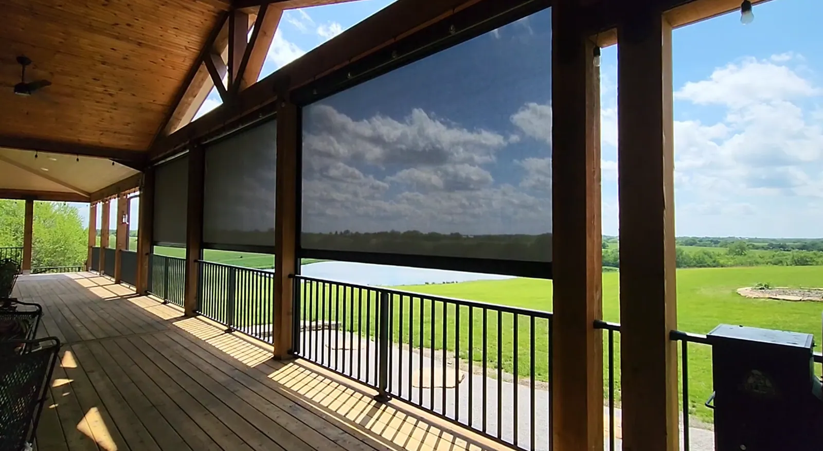 Exterior shades half closed on a patio deck