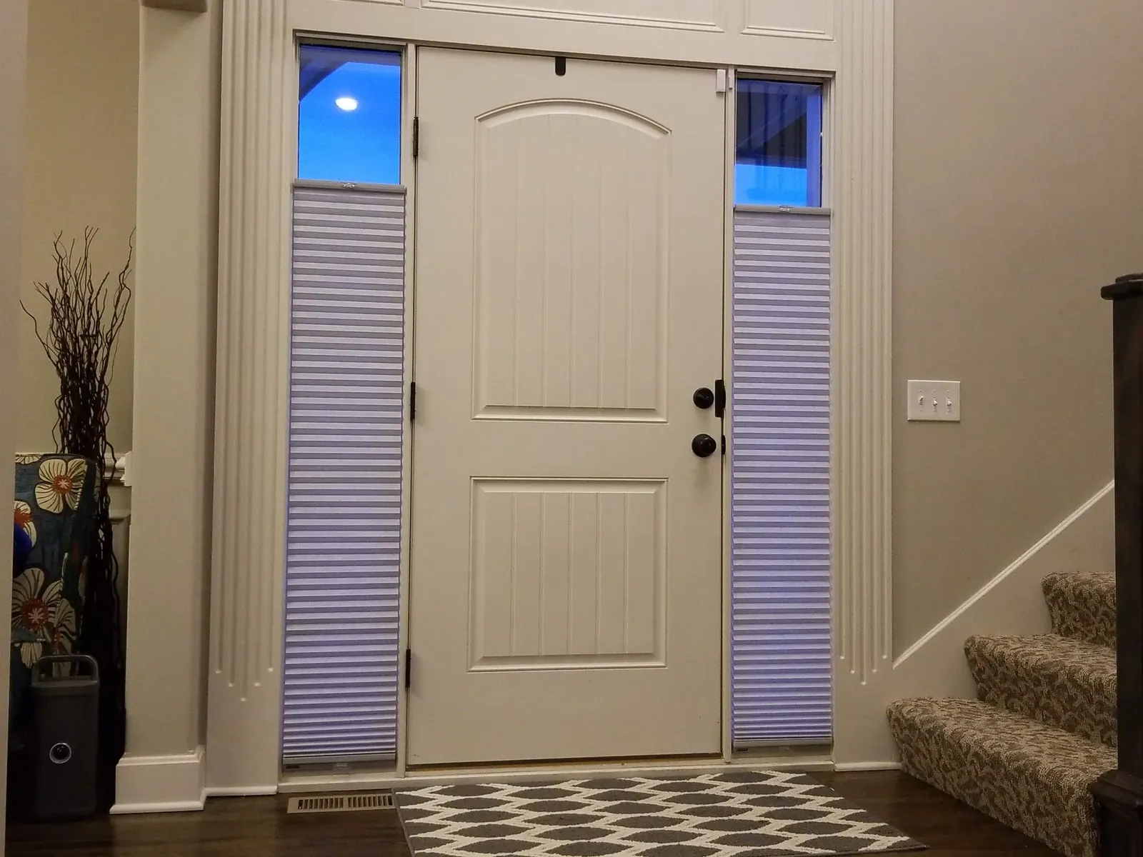 Honeycomb shades on front door sidelights