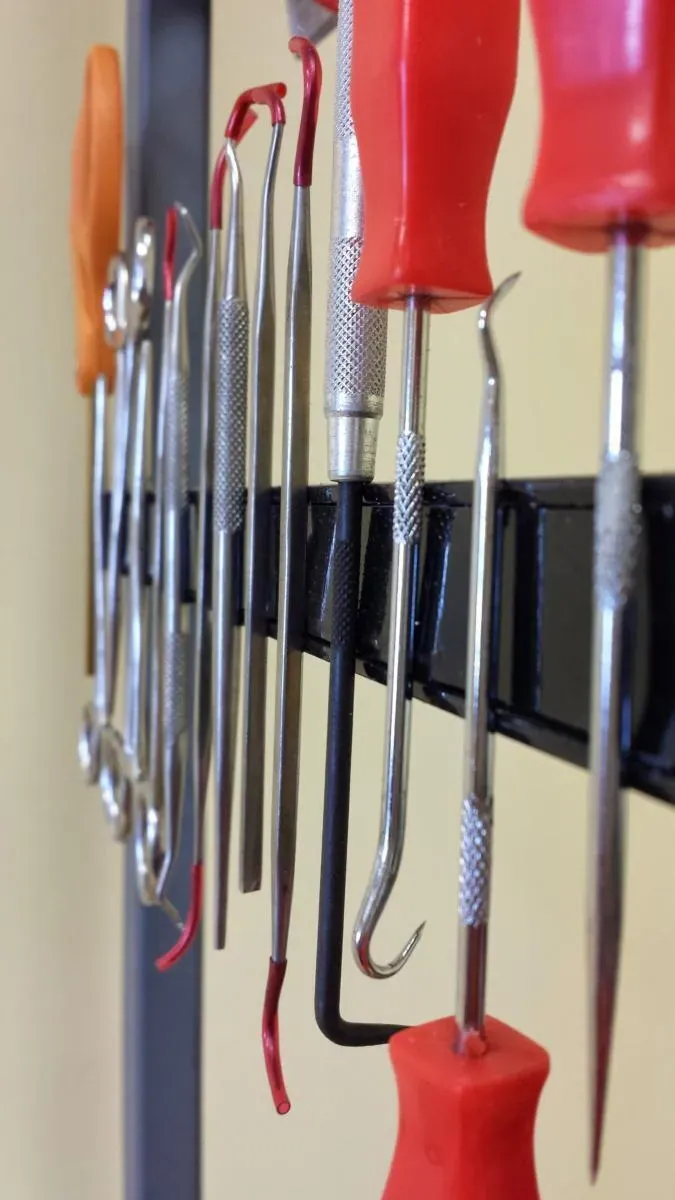 Picks and hand tools hung on a rack