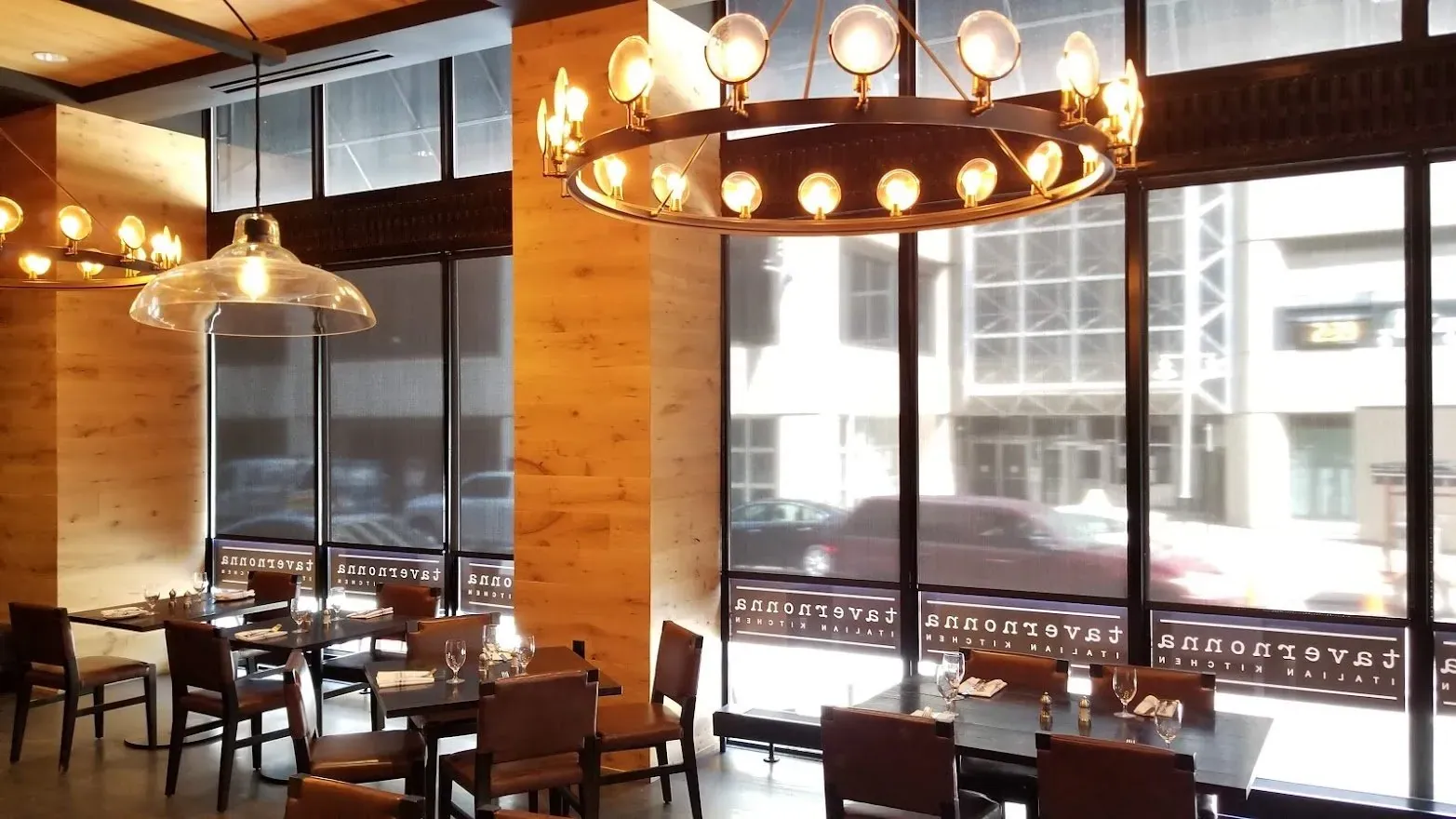 Roller Shades on the front windows of a restaurant, installed by Solar Shield Blinds