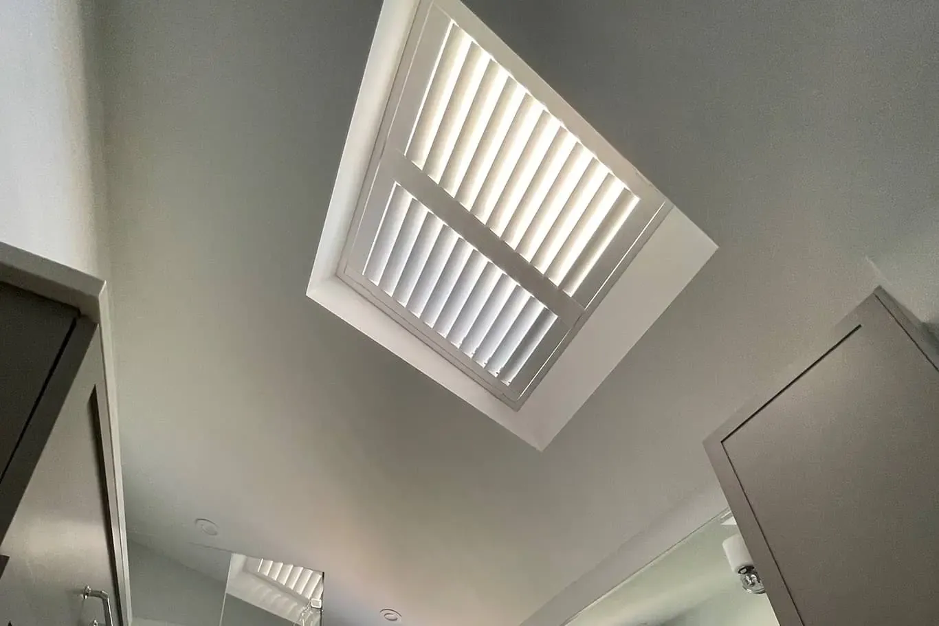 Shutters on a bathroom skylight