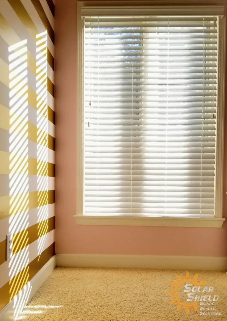 Wood & Faux Wood Blinds in a living room, installed by Solar Shield Blinds