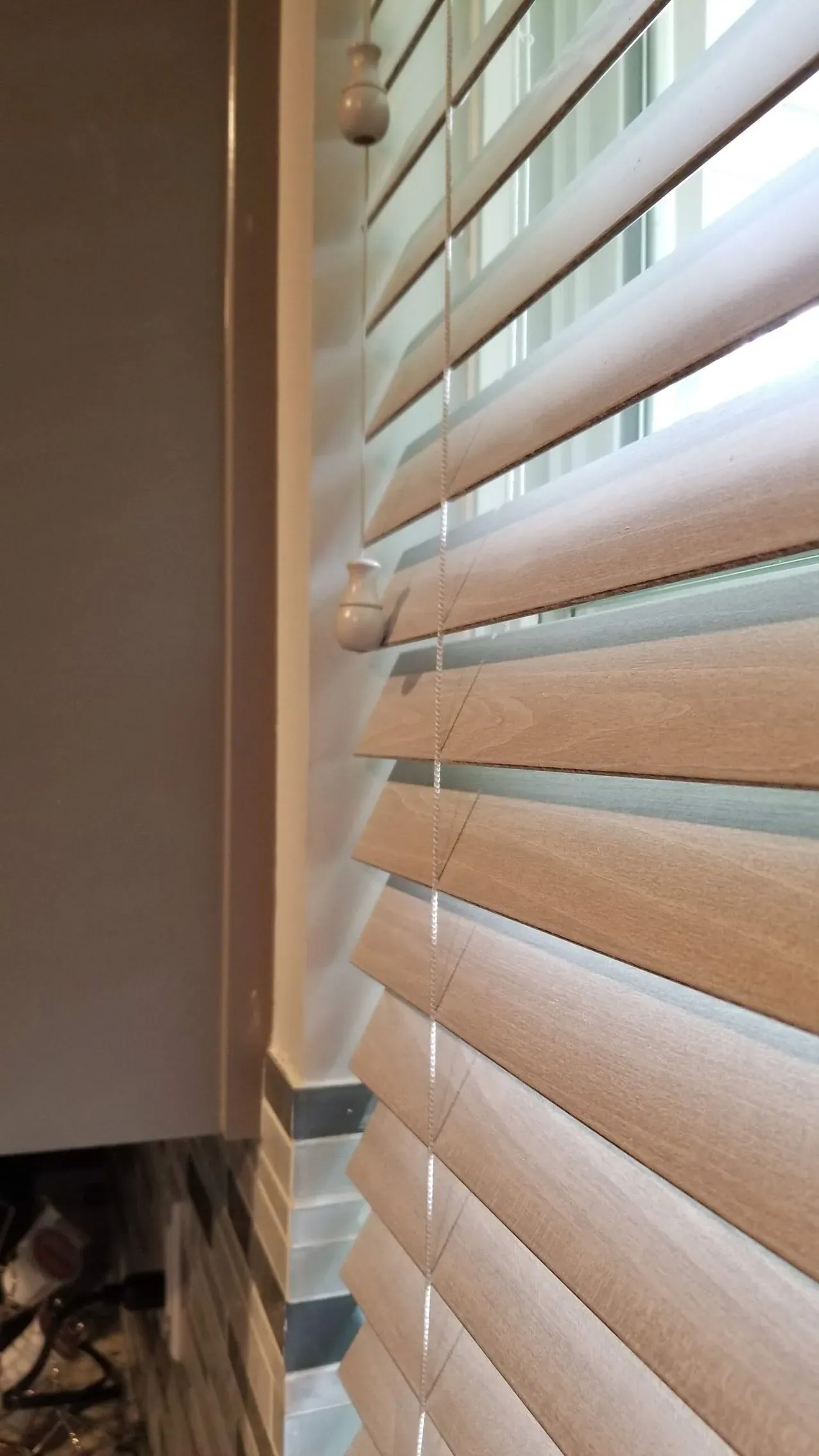 Wood blinds close up in a living room, installed by Solar Shield Blinds