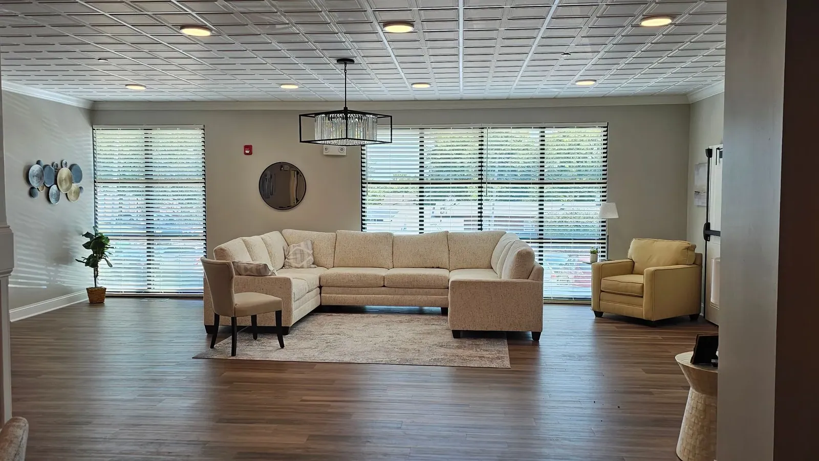 Wood & Faux Wood Blinds in college sorority housing living room, installed by Solar Shield Blinds
