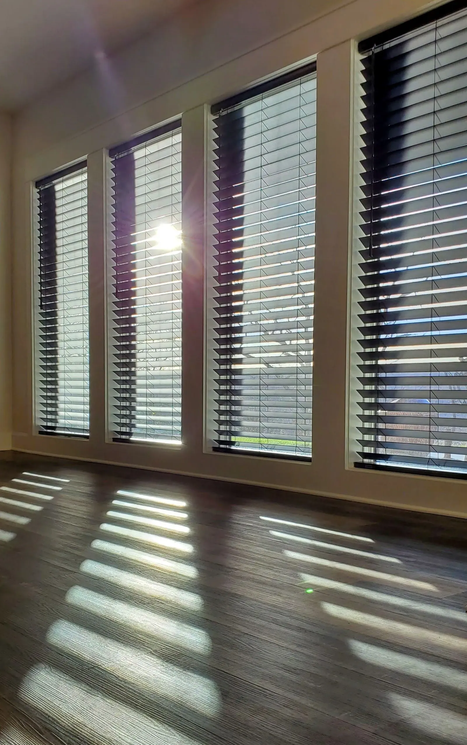 Wood & Faux Wood Blinds in a living room, measured and hung by Solar Shield Blinds